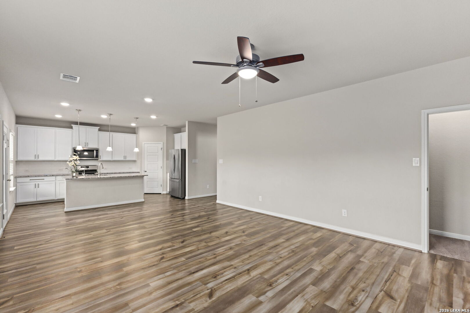 12221 Icon Ridge San Antonio, TX 78253 - Photo 11 of 46 a view of kitchen view with wooden floor and window