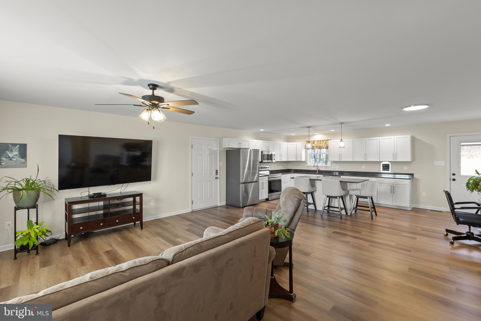4009 Ridge Road Quicksburg, VA 22847 - Photo 11 of 41 a living room with furniture and a flat screen tv