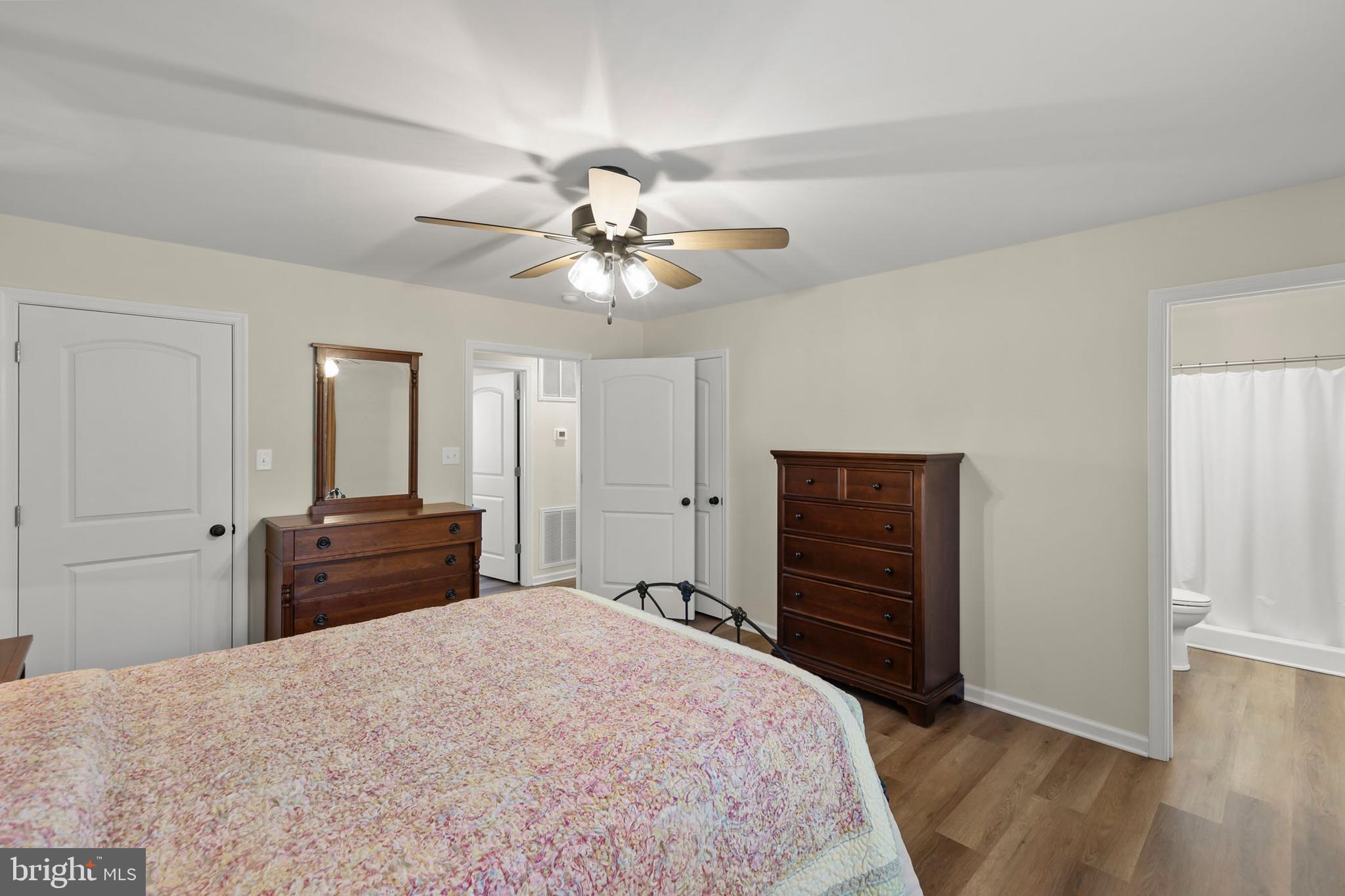 4009 Ridge Road Quicksburg, VA 22847 - Photo 15 of 41 a bedroom with a bed and a chandelier