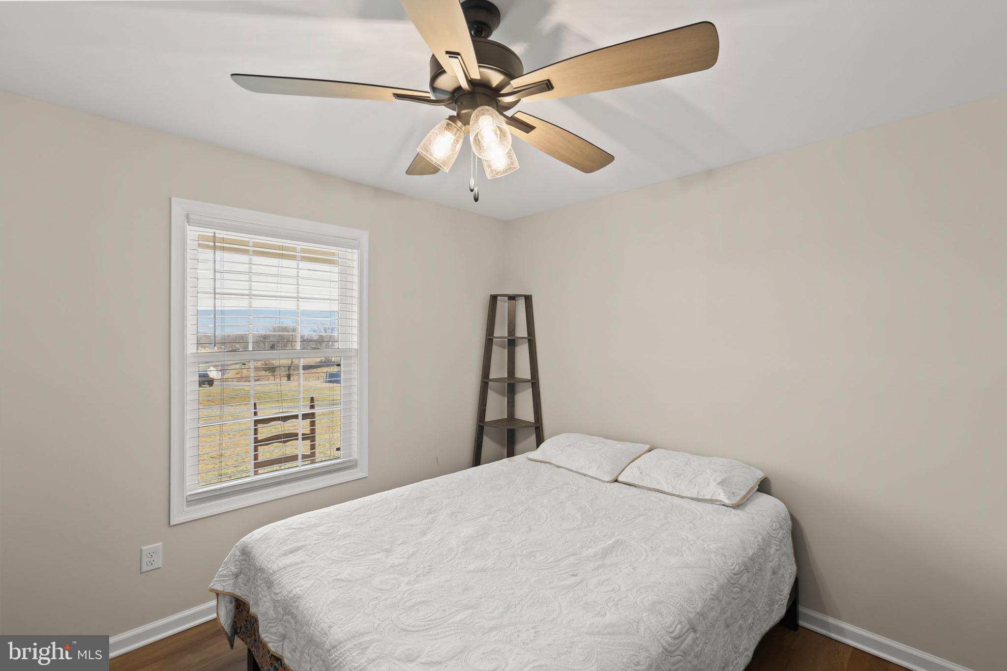 4009 Ridge Road Quicksburg, VA 22847 - Photo 18 of 41 a bedroom with a bed and a window