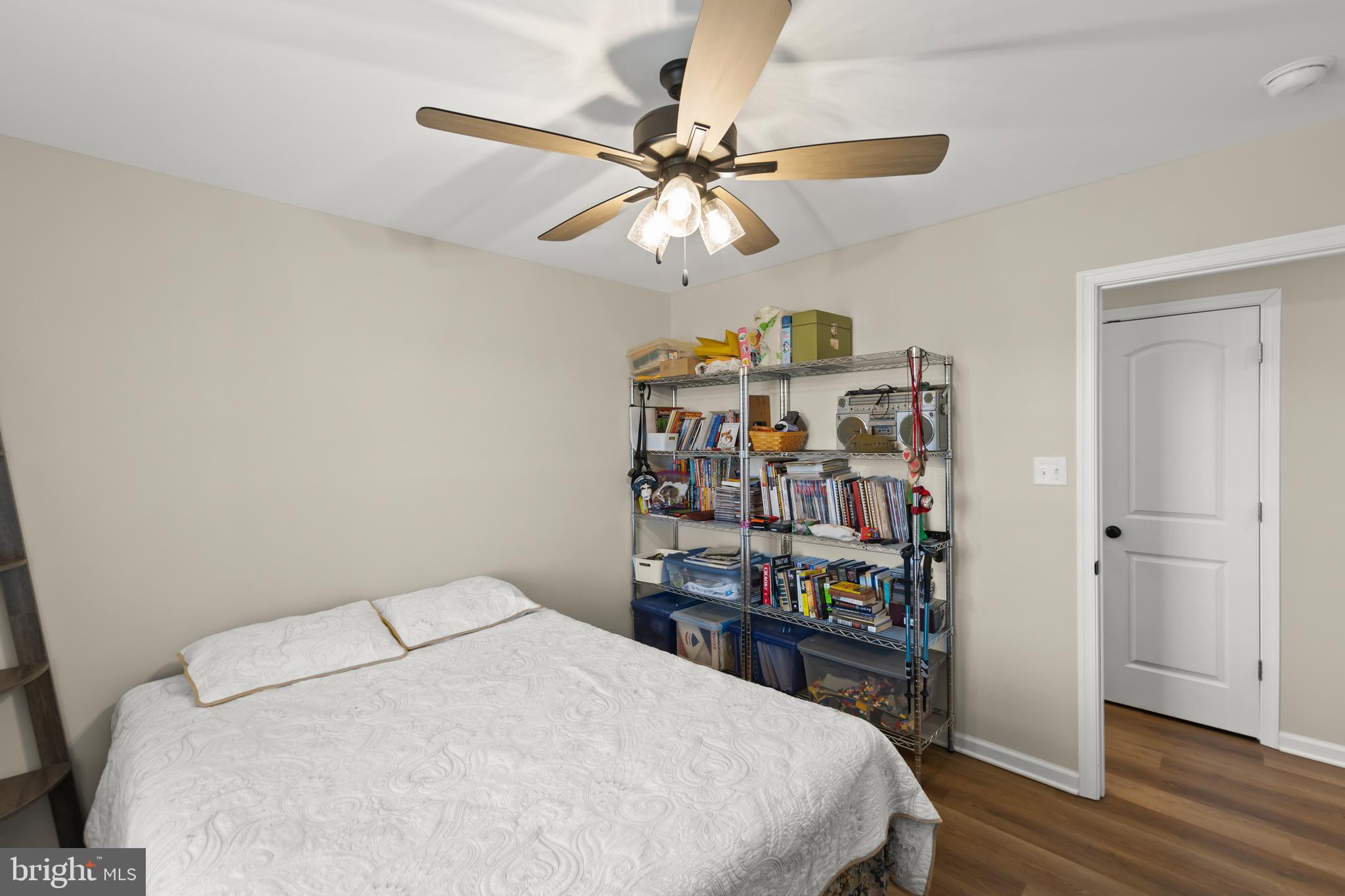 4009 Ridge Road Quicksburg, VA 22847 - Photo 20 of 41 a bedroom with a bed and a book shelf