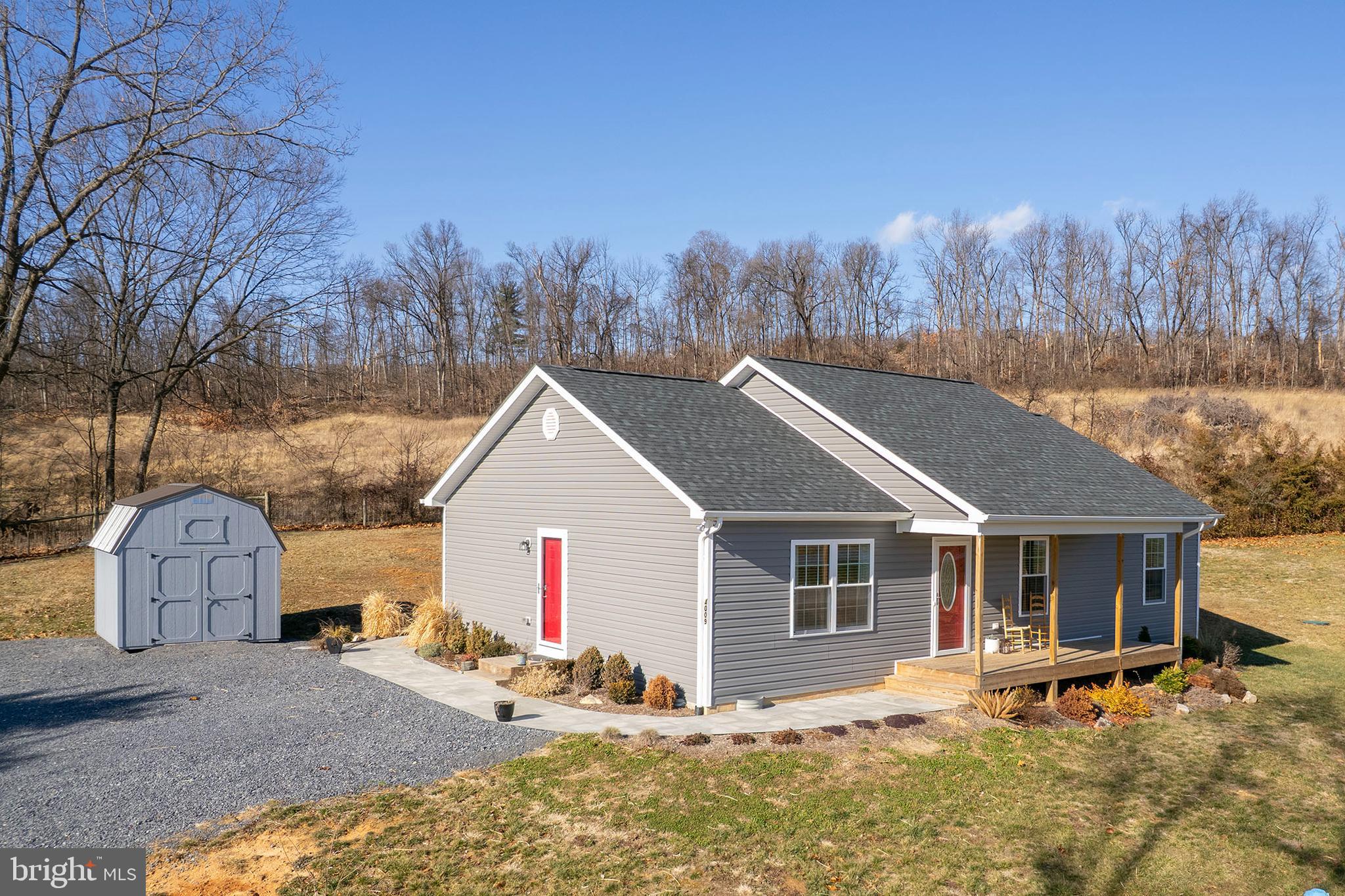 4009 Ridge Road Quicksburg, VA 22847 - Photo 33 of 41 a front view of house with yard and trees in the background