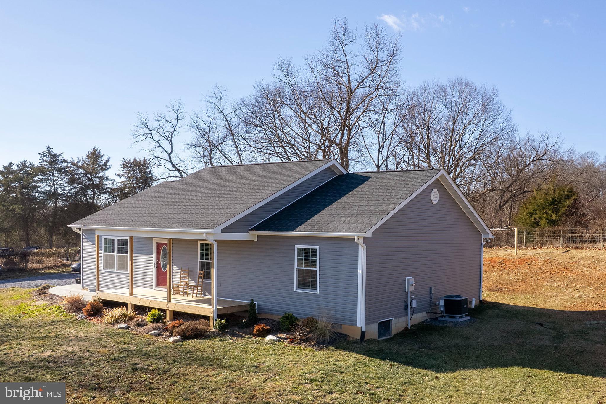 4009 Ridge Road Quicksburg, VA 22847 - Photo 34 of 41 a backyard of a house with yard fire pit and outdoor seating