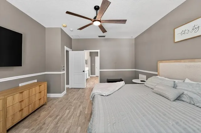a spacious bathroom with a double vanity sink a mirror and shower