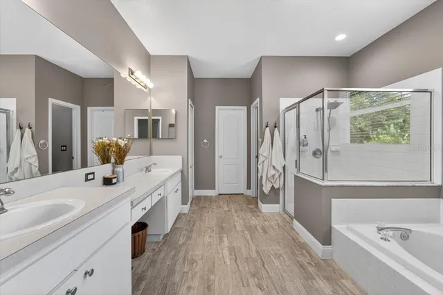 a bathroom with a bathtub and a shower