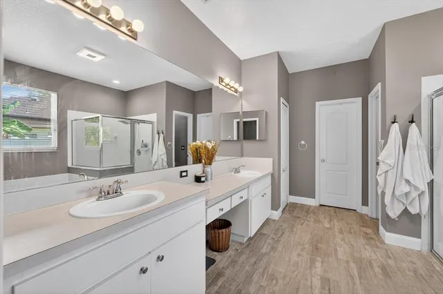 a bathroom with a toilet a sink and a window