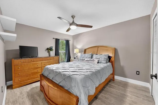 a view of a house with swimming pool and sitting area