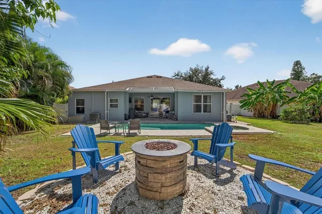 a view of a livingroom with furniture and a window