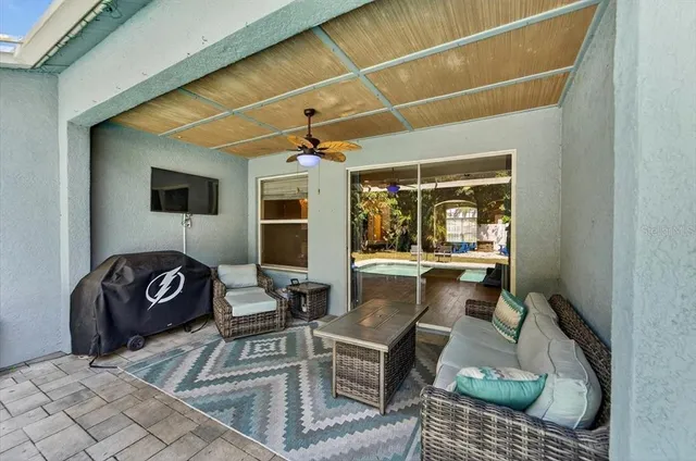 a view of a house with swimming pool and sitting area