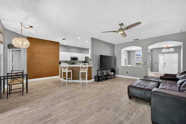 a kitchen with stainless steel appliances a stove sink microwave and cabinets