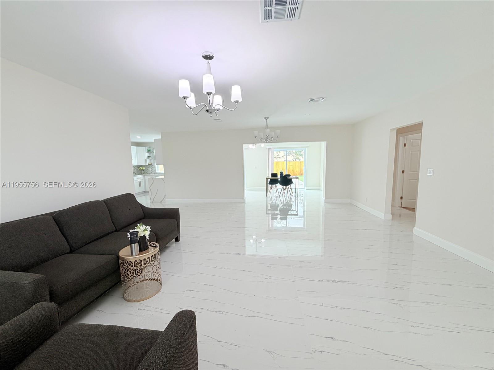 4241 Thomas Street Hollywood, FL 33021 - Photo 19 of 91 a living room with furniture and a wooden floor