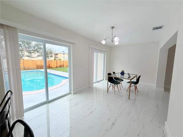 a kitchen with cabinets stainless steel appliances and a counter top space
