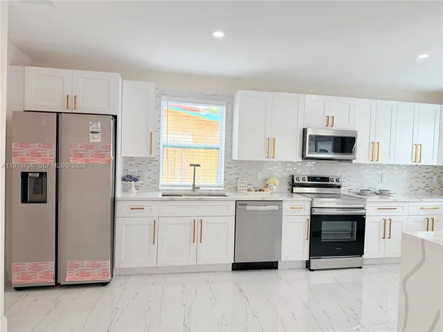 a view of room with a ceiling fan and window