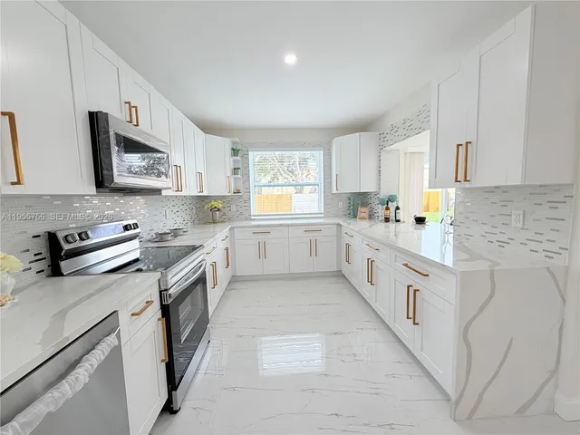 a view of a chandelier fan and wooden floor