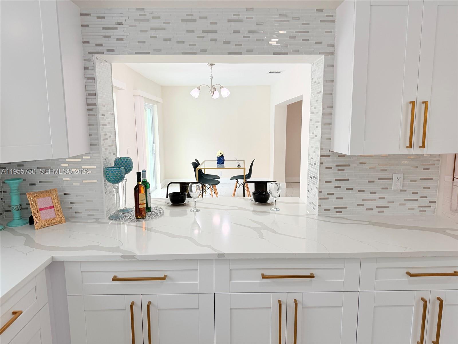 4241 Thomas Street Hollywood, FL 33021 - Photo 36 of 91 a bathroom with a sink and a mirror