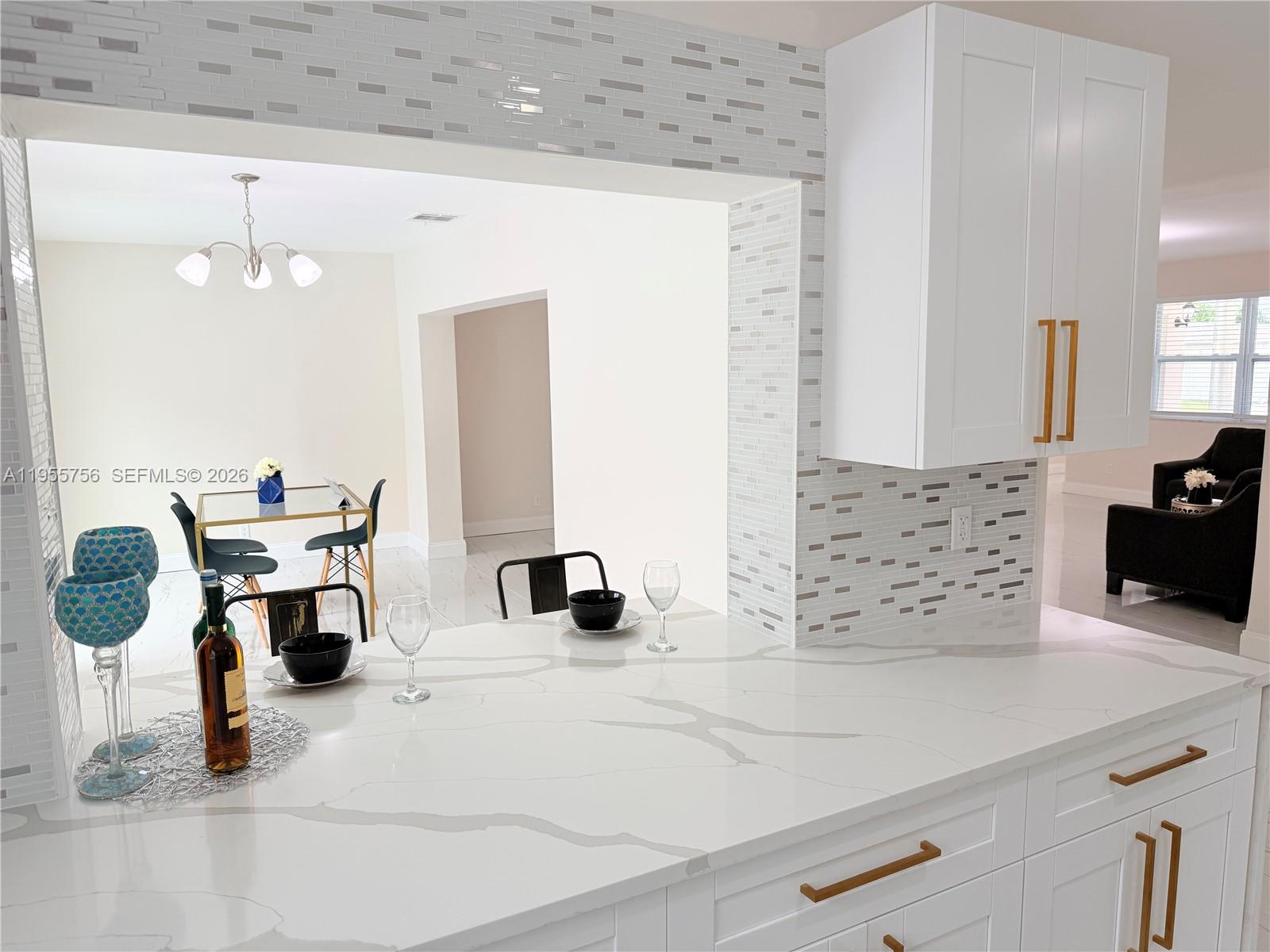 4241 Thomas Street Hollywood, FL 33021 - Photo 39 of 91 a bathroom with a sink and a mirror