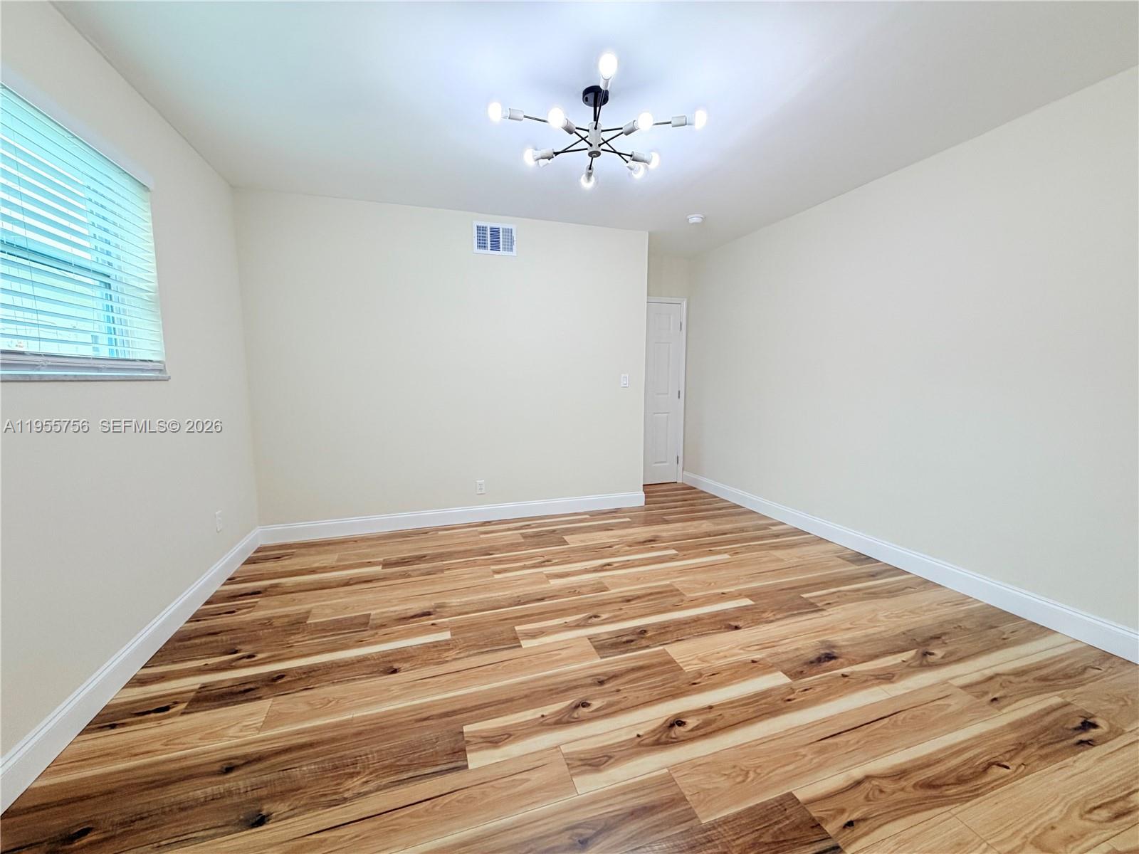 4241 Thomas Street Hollywood, FL 33021 - Photo 46 of 91 a view of a room with wooden floor and a ceiling fan