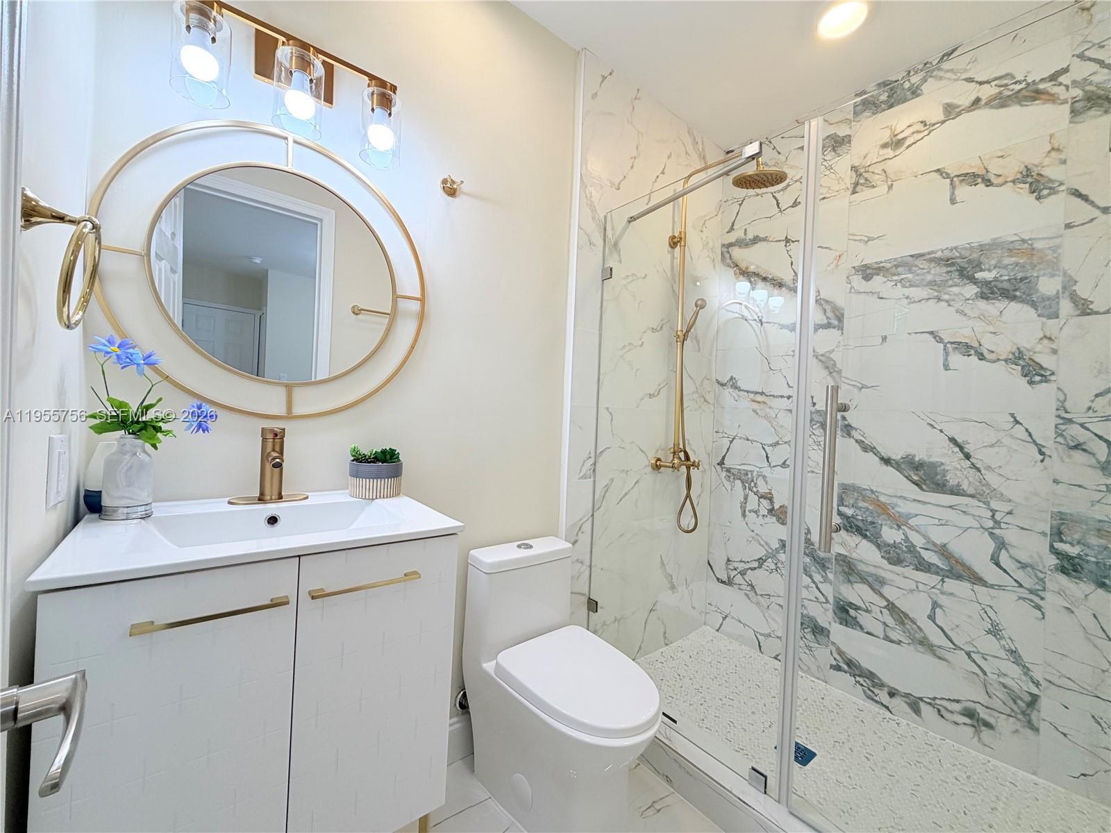 4241 Thomas Street Hollywood, FL 33021 - Photo 49 of 91 a bathroom with a sink toilet and shower
