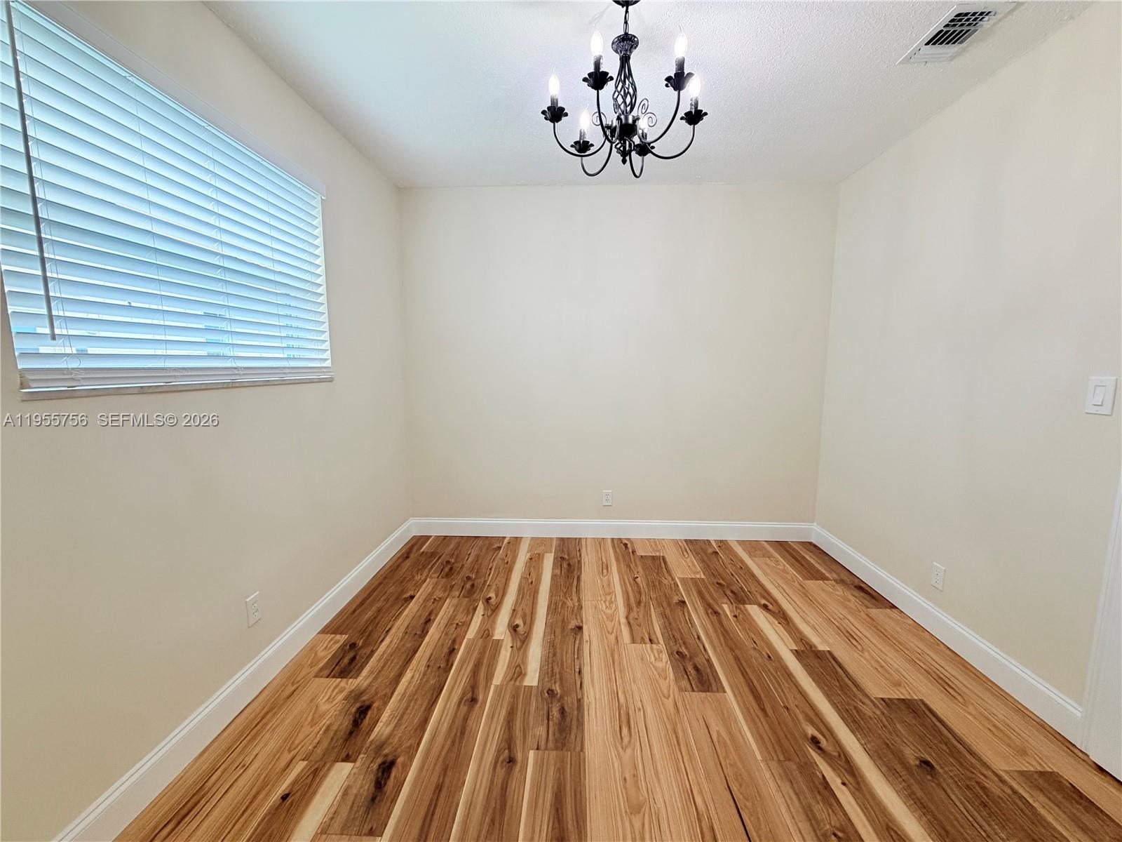 4241 Thomas Street Hollywood, FL 33021 - Photo 53 of 91 a view of a room with wooden floor and a window