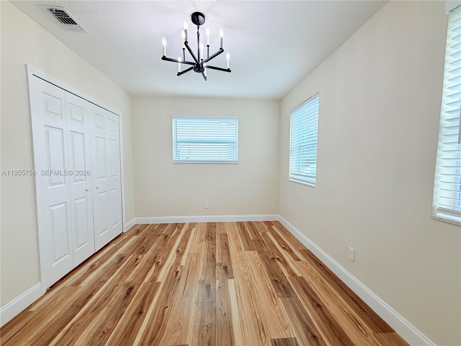 4241 Thomas Street Hollywood, FL 33021 - Photo 55 of 91 a view of empty room with wooden floor and window