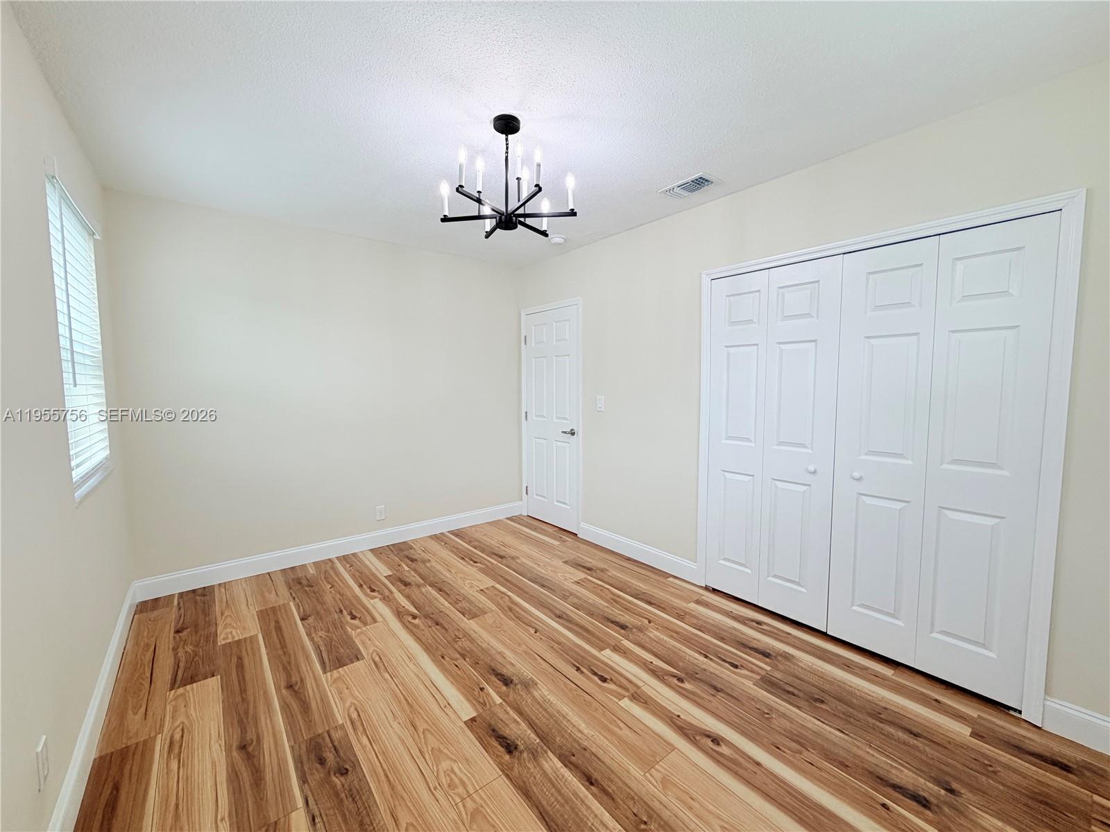 4241 Thomas Street Hollywood, FL 33021 - Photo 57 of 91 a view of empty room with wooden floor