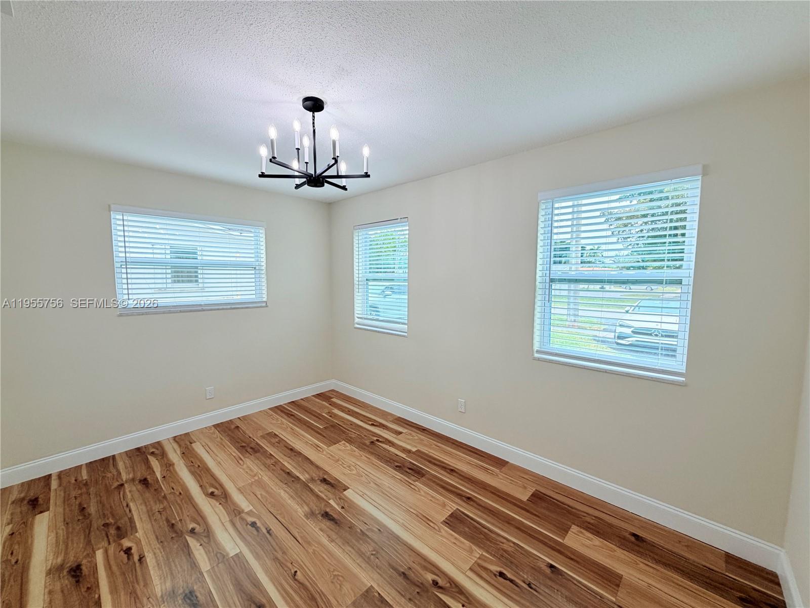 4241 Thomas Street Hollywood, FL 33021 - Photo 60 of 91 a view of a room with wooden floor and a window
