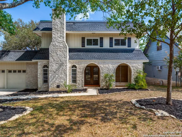 a front view of a house with yard