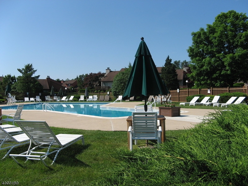250 Ridgedale Avenue, Unit B 8 Florham Park, NJ 07932 - Photo 18 of 19 a view of a table and chairs in the garden