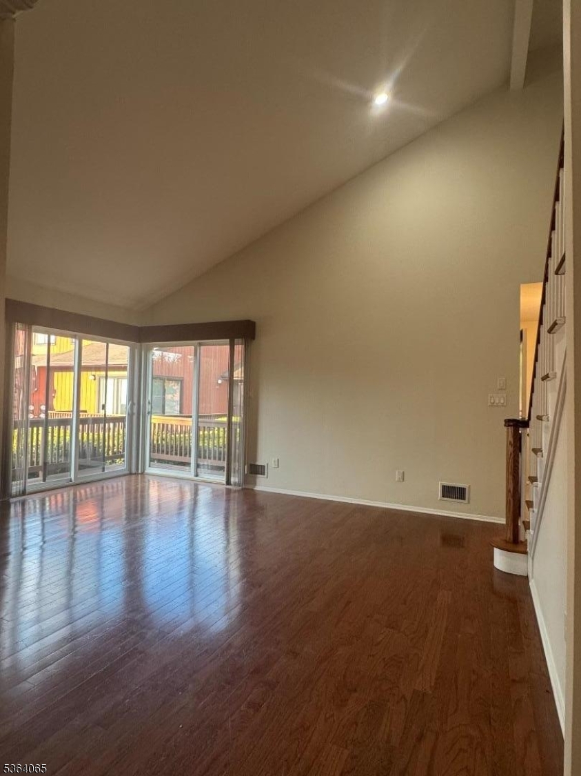 250 Ridgedale Avenue, Unit B 8 Florham Park, NJ 07932 - Photo 7 of 20 an empty room with wooden floor and windows