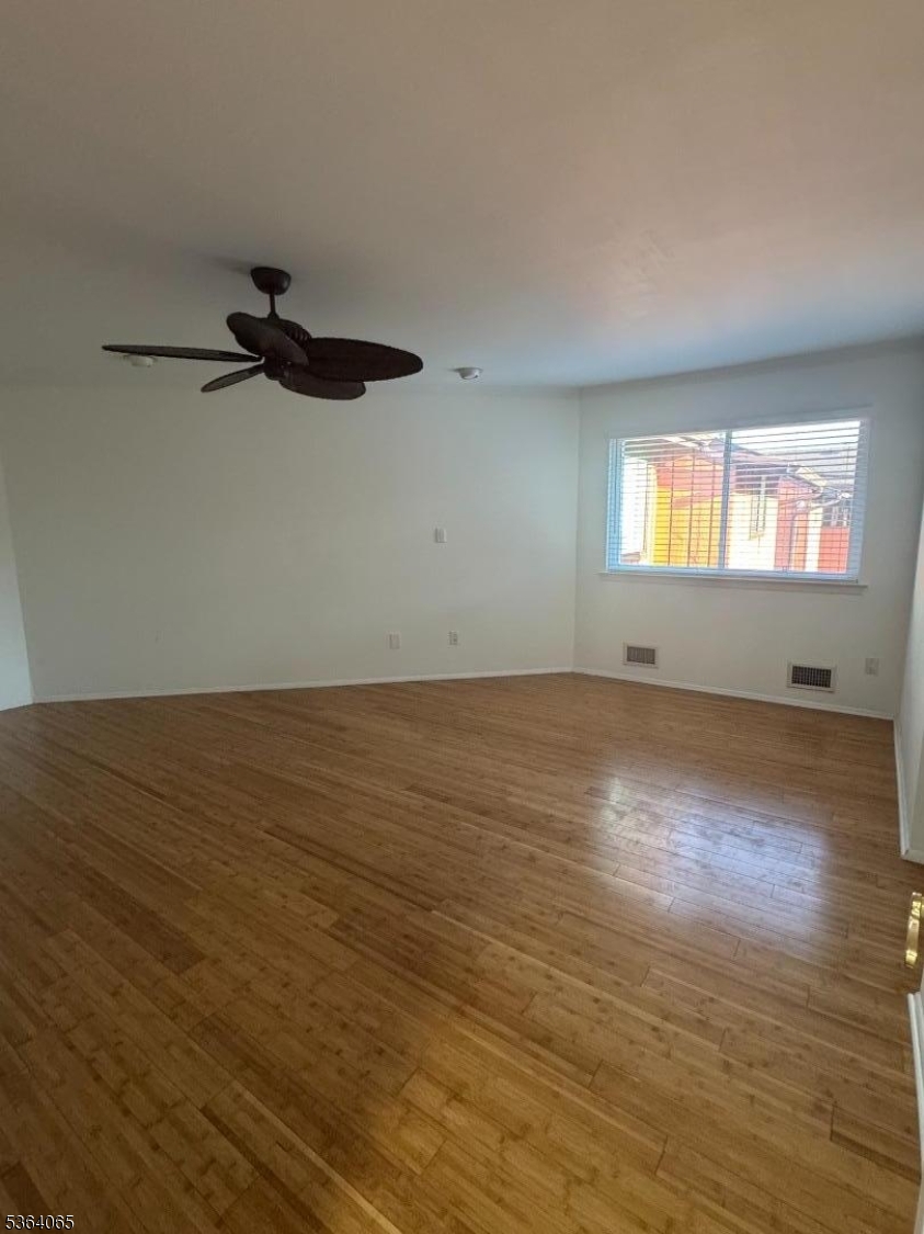 250 Ridgedale Avenue, Unit B 8 Florham Park, NJ 07932 - Photo 10 of 20 an empty room with wooden floor and windows