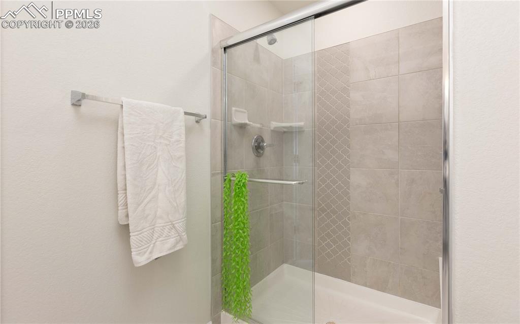 4031 Samaritan Loop Colorado Springs, CO 80916 - Photo 14 of 34 a bathroom with a shower and a shower