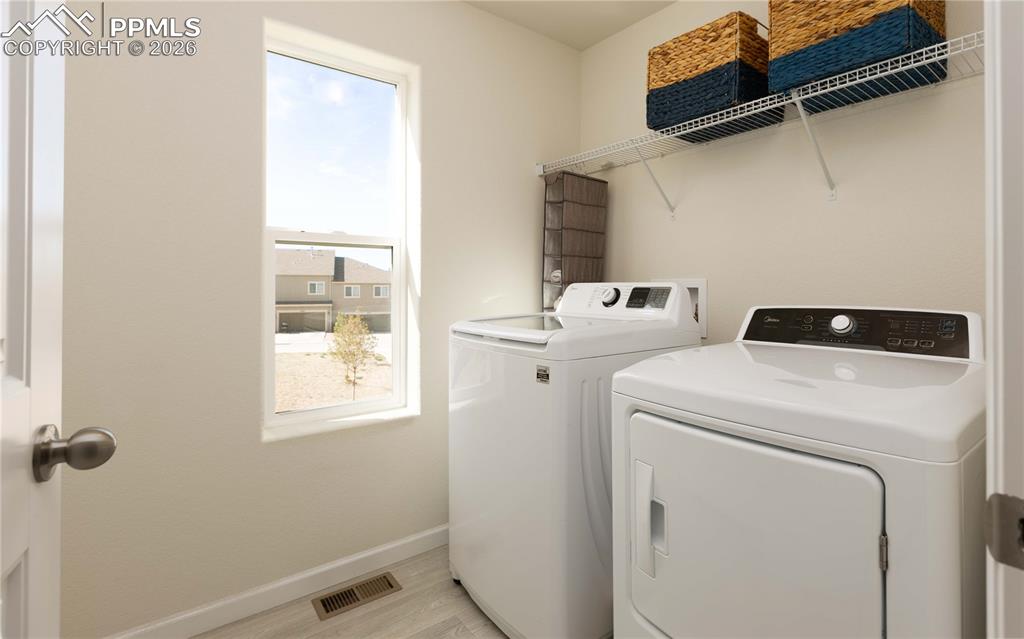 4031 Samaritan Loop Colorado Springs, CO 80916 - Photo 15 of 34 a utility room with dryer and washer