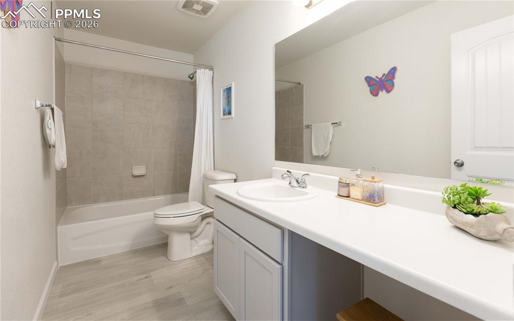 4031 Samaritan Loop Colorado Springs, CO 80916 - Photo 18 of 34 a bathroom with a sink toilet and shower