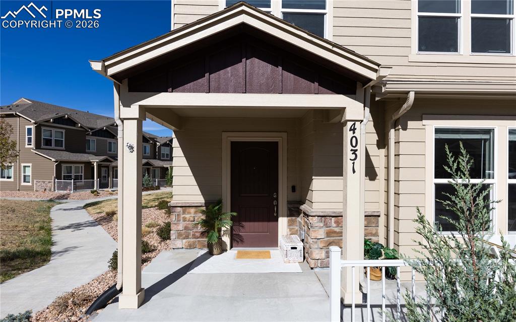4031 Samaritan Loop Colorado Springs, CO 80916 - Photo 2 of 34 a front view of a house with a yard