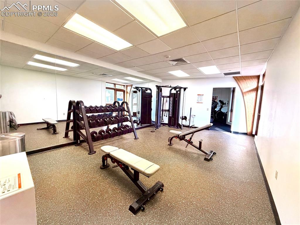 4031 Samaritan Loop Colorado Springs, CO 80916 - Photo 29 of 34 a view of a gym room with gym equipment