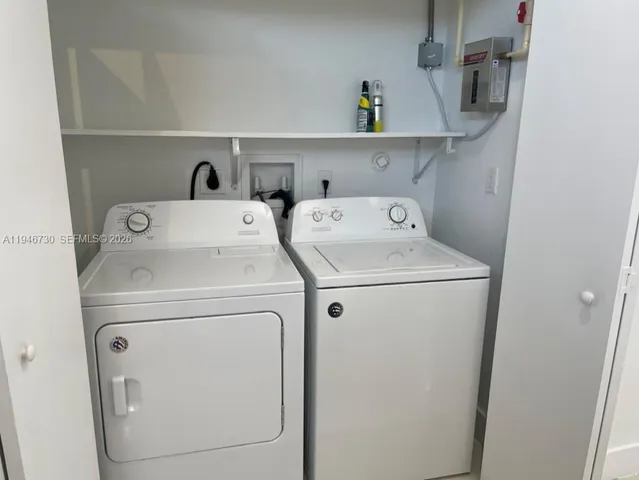 a utility room with dryer and washer