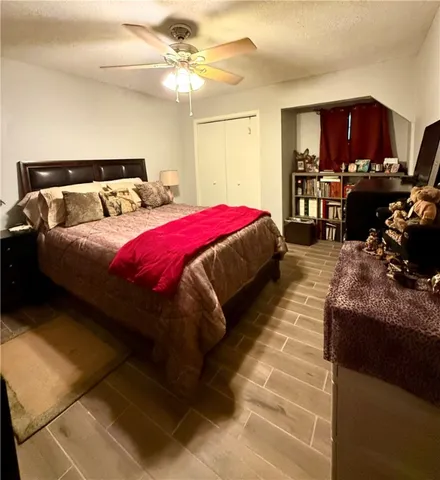 a bed room with a bed and a chandelier