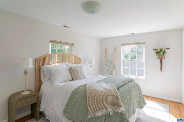 a bed room with a bed and a window