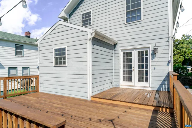 a view of a house with a wooden deck