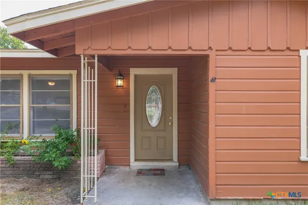 a view of door with washer and dryer