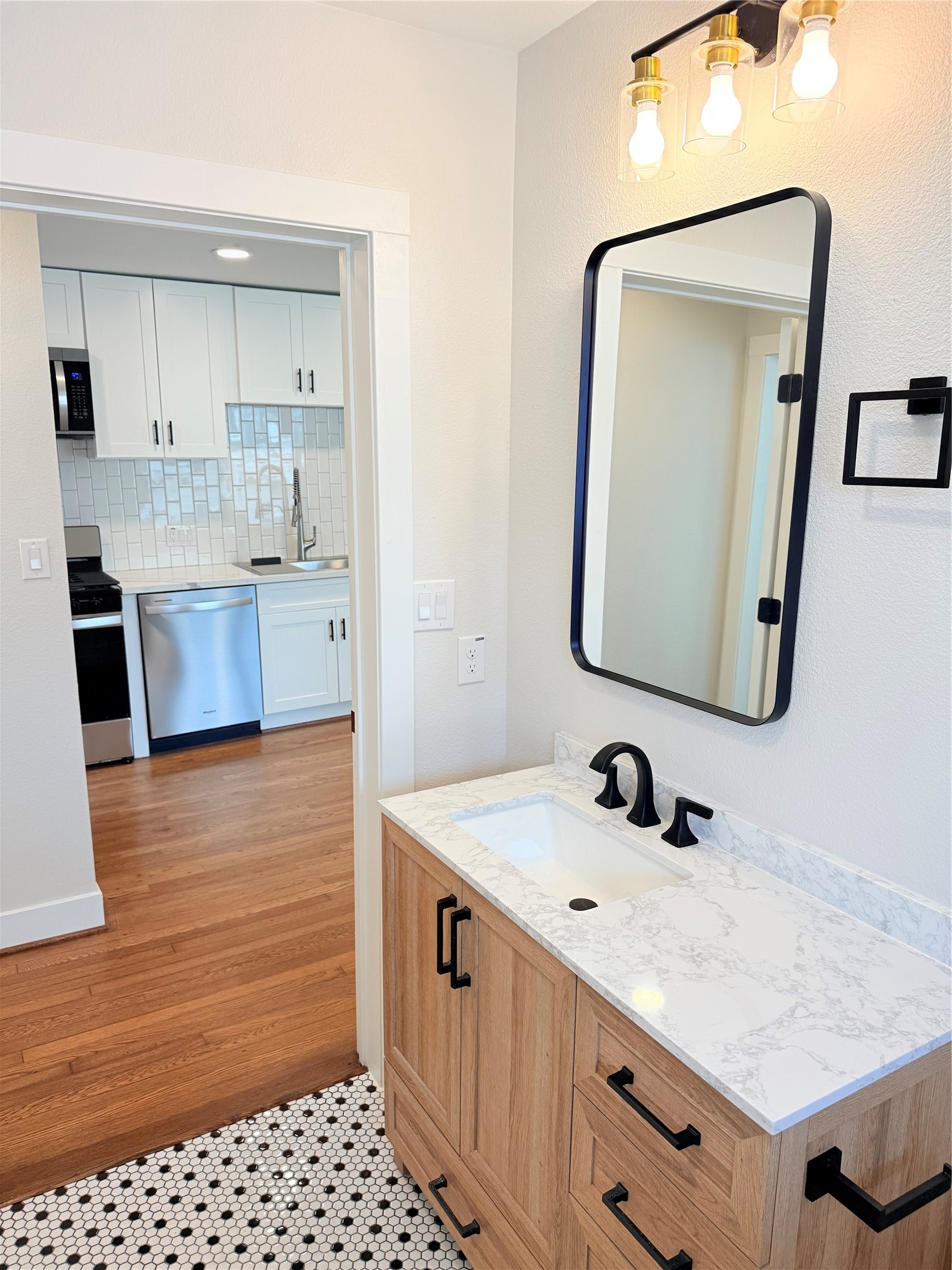 2001 Brun Street, Unit 1 Houston, TX 77019 - Photo 8 of 15 a bathroom with a sink a vanity and a mirror