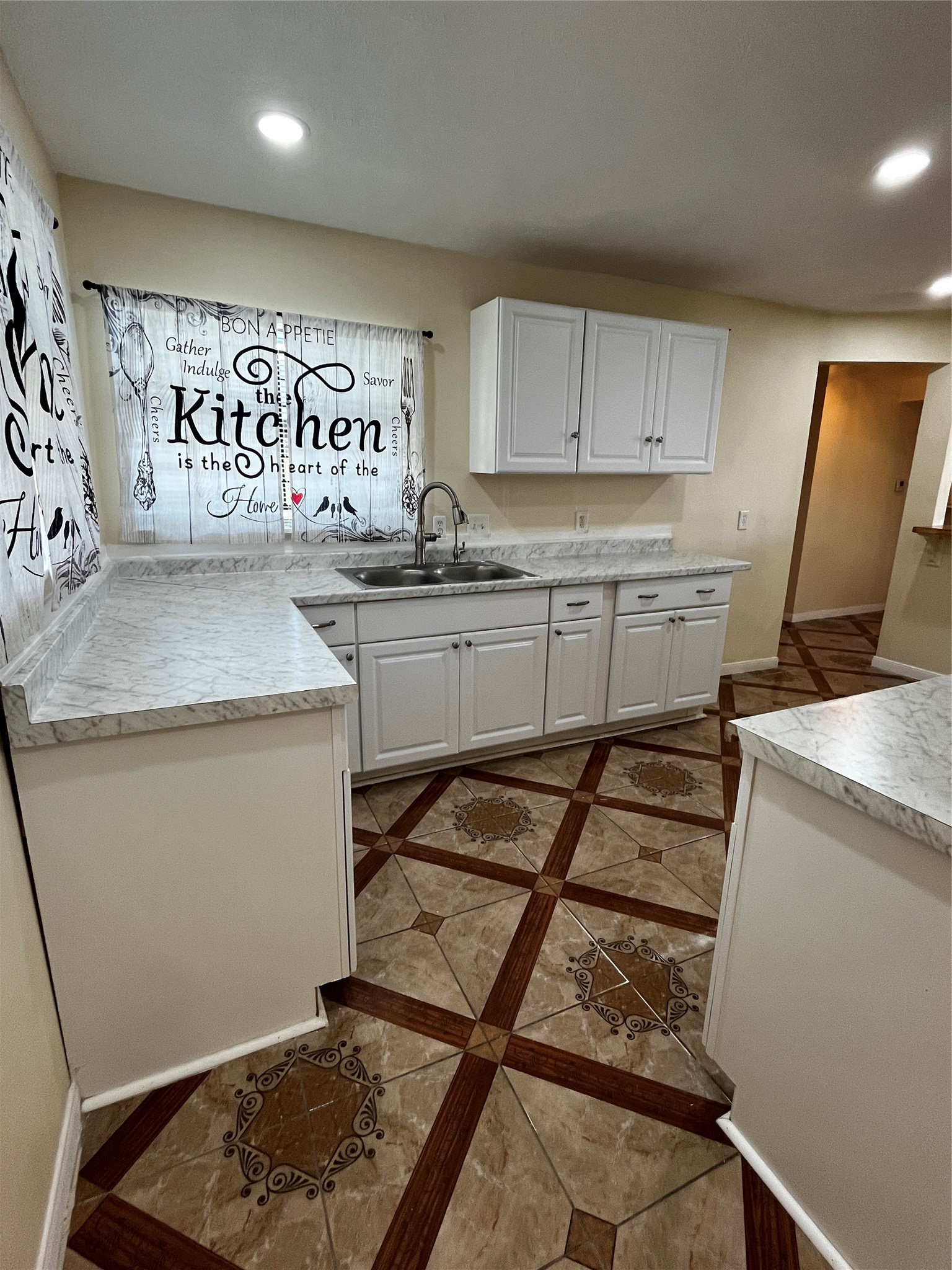3163 Roe Drive Houston, TX 77087 - Photo 24 of 47 a kitchen with sink cabinets and window