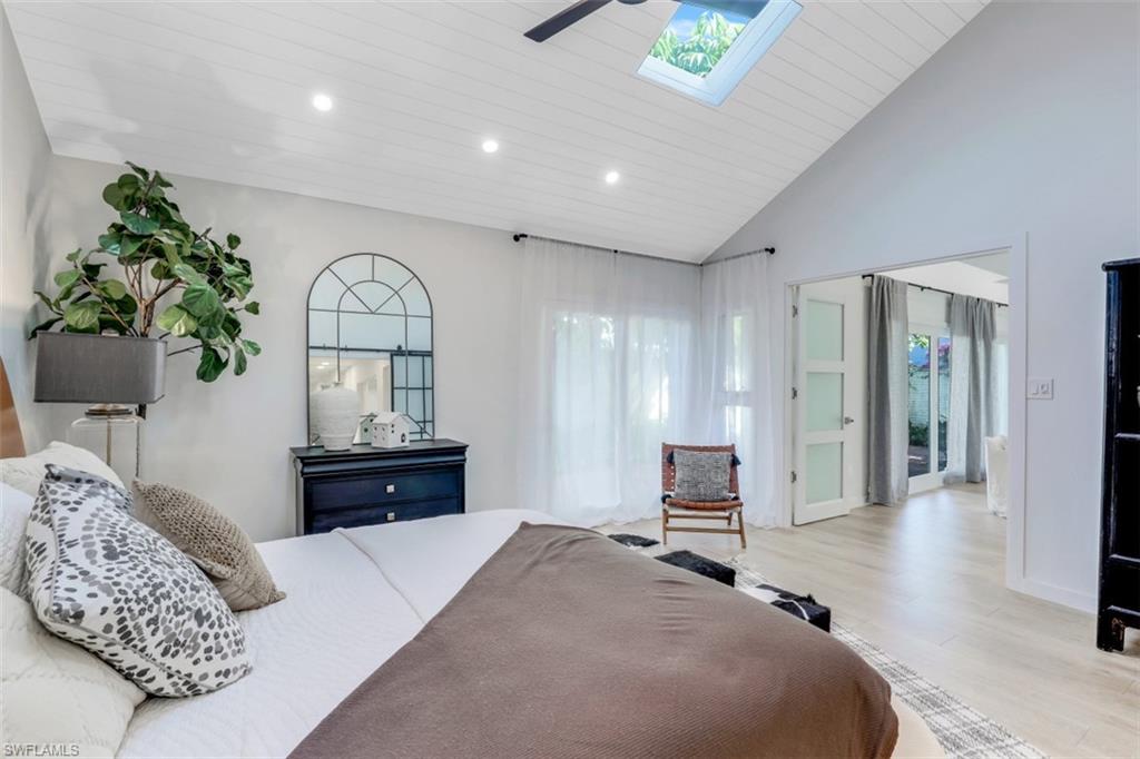 651 Bridge Way Lane, Unit 143 Naples, FL 34108 - Photo 13 of 27 a bedroom with a bed and a dresser