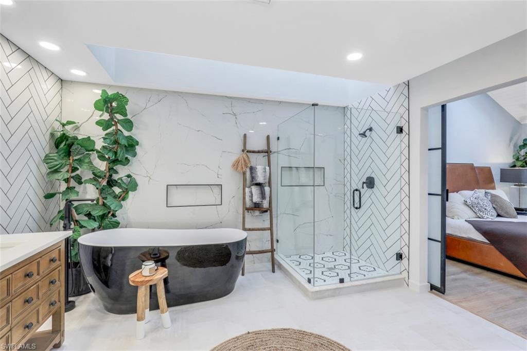 651 Bridge Way Lane, Unit 143 Naples, FL 34108 - Photo 15 of 27 a living room with furniture and a patio