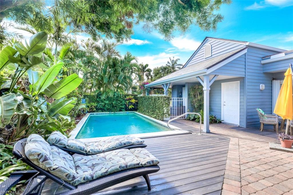 651 Bridge Way Lane, Unit 143 Naples, FL 34108 - Photo 21 of 27 a patio with table and chairs