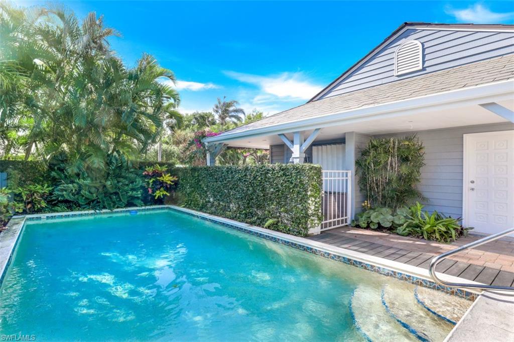 651 Bridge Way Lane, Unit 143 Naples, FL 34108 - Photo 23 of 27 a view of a house with a backyard