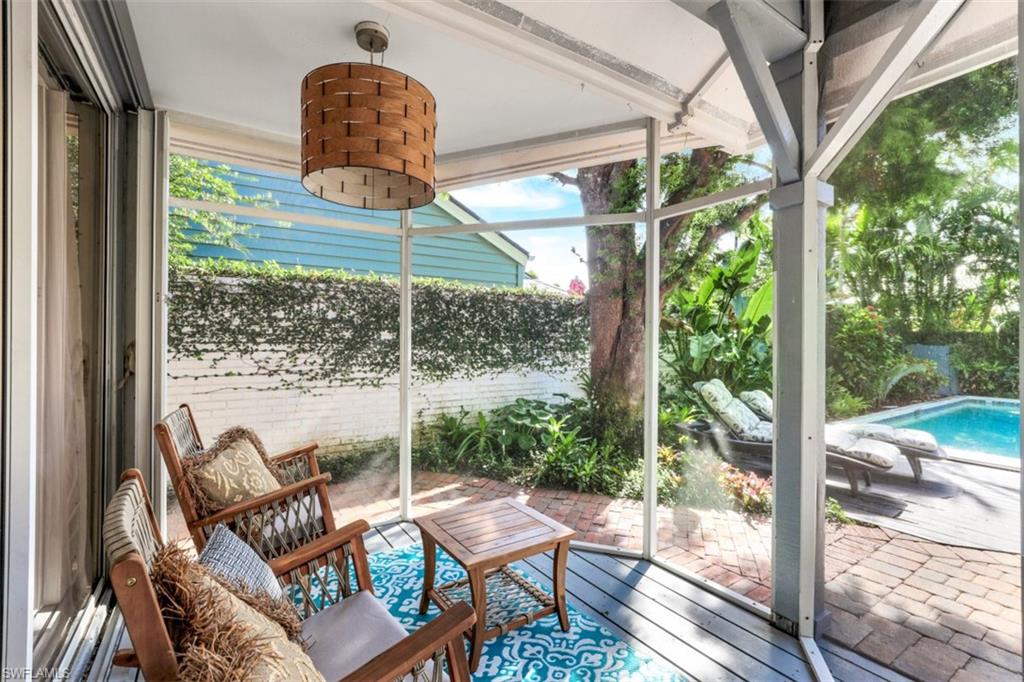 651 Bridge Way Lane, Unit 143 Naples, FL 34108 - Photo 24 of 27 a view of chair in the balcony