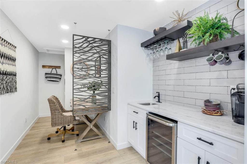 651 Bridge Way Lane, Unit 143 Naples, FL 34108 - Photo 10 of 27 a view of a kitchen with a sink and cabinets