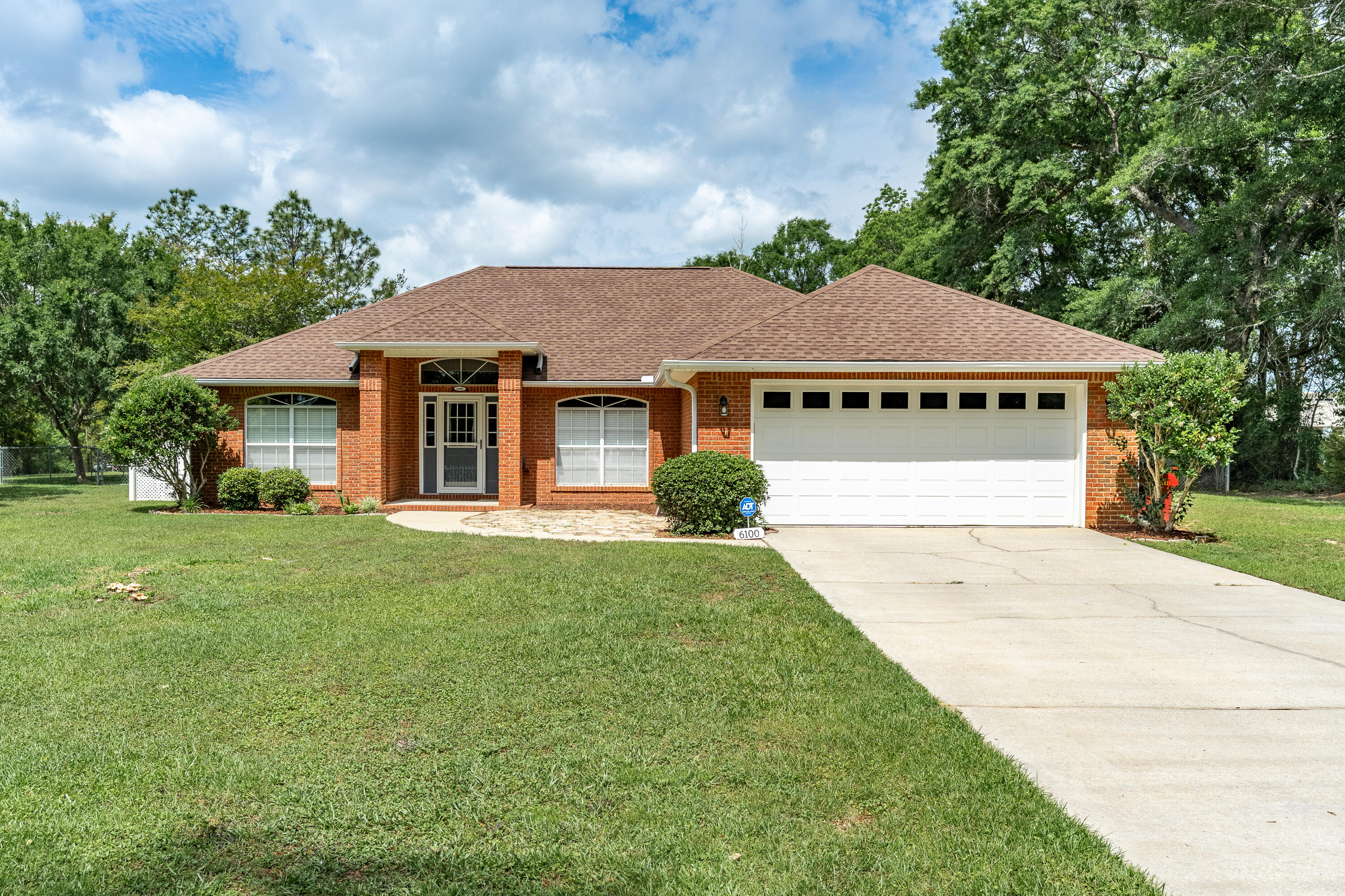 6100 Buckward Road Baker, FL 32531 - Photo 2 of 55 a front view of a house with a yard