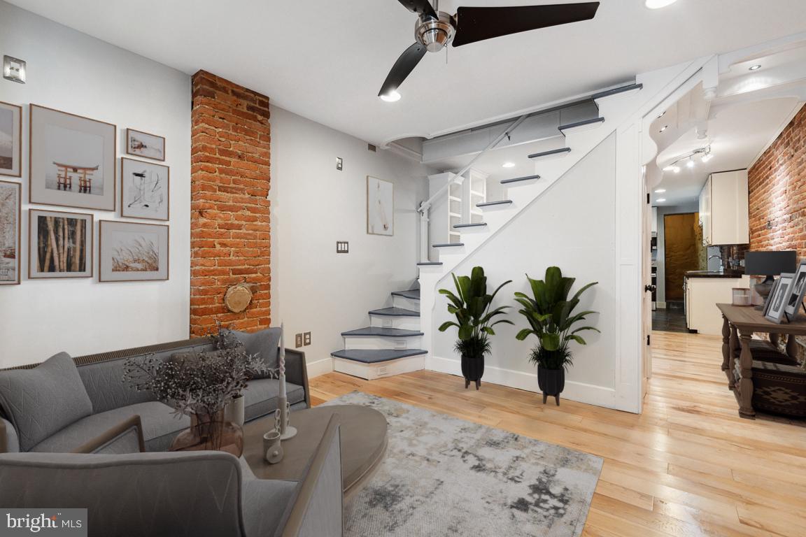 3359 Falls Road Baltimore, MD 21211 - Photo 1 of 19 Living room with exposed brick